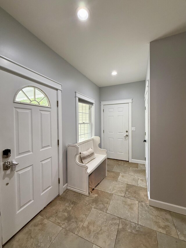 2176 Deepwoods Dr, Gaylord, MI 49735 - foyer featuring plenty of natural light, light stone finish flooring, and recessed lighting