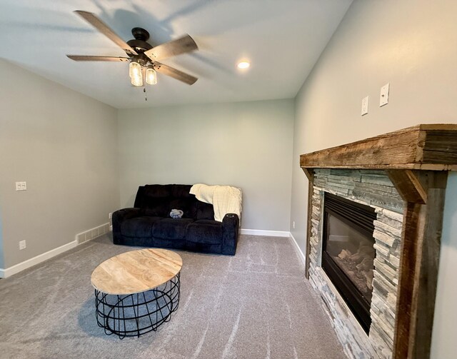 2176 Deepwoods Dr, Gaylord, MI 49735 - carpeted living room with a ceiling fan and a fireplace