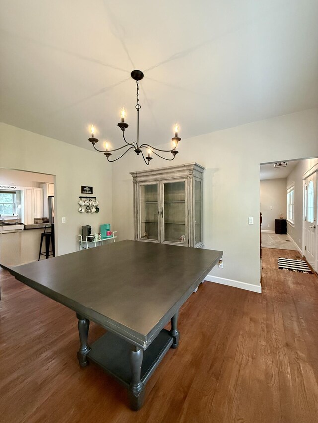 2176 Deepwoods Dr, Gaylord, MI 49735 - dining space with wood finished floors and a chandelier