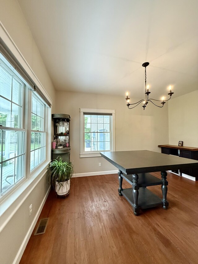 2176 Deepwoods Dr, Gaylord, MI 49735 - rec room featuring wood finished floors and a chandelier