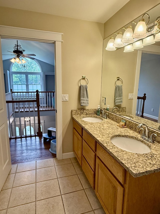 2176 Deepwoods Dr, Gaylord, MI 49735 - bathroom with a ceiling fan, double vanity, and tile patterned floors