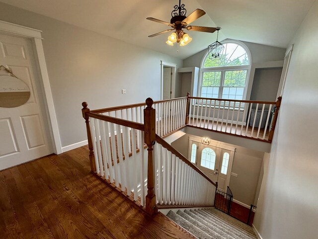 2176 Deepwoods Dr, Gaylord, MI 49735 - staircase with lofted ceiling, ceiling fan, and wood finished floors
