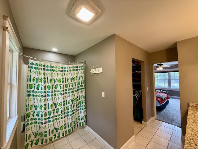 2176 Deepwoods Dr, Gaylord, MI 49735 - bathroom featuring tile patterned floors, curtained shower, a ceiling fan, and recessed lighting