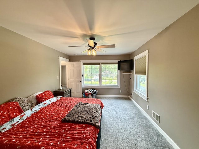 2176 Deepwoods Dr, Gaylord, MI 49735 - carpeted bedroom featuring baseboards and ceiling fan