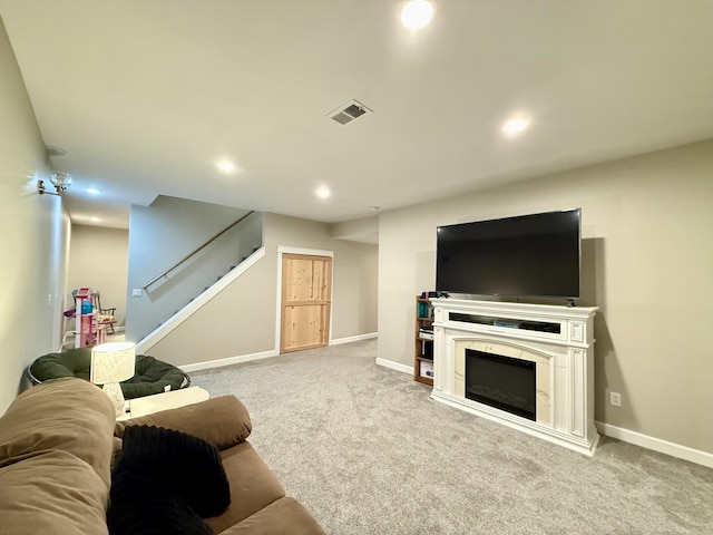 2176 Deepwoods Dr, Gaylord, MI 49735 - living area featuring carpet, stairs, and recessed lighting
