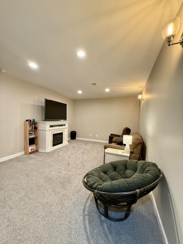 2176 Deepwoods Dr, Gaylord, MI 49735 - living area featuring carpet floors, recessed lighting, and a fireplace