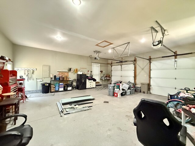 2176 Deepwoods Dr, Gaylord, MI 49735 - garage featuring a garage door opener