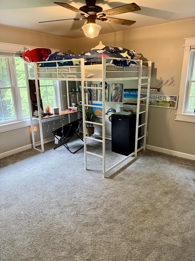2176 Deepwoods Dr, Gaylord, MI 49735 - carpeted bedroom featuring an office area and a ceiling fan