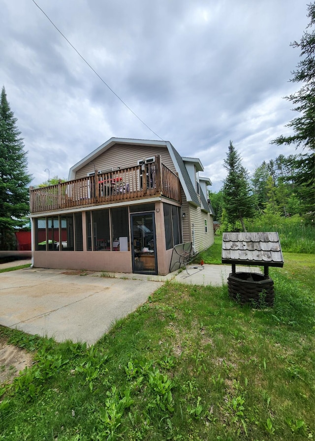7451 June Ave, Saint Helen, MI 48656 - rear view of property featuring a gambrel roof and a lawn