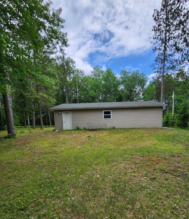 7451 June Ave, Saint Helen, MI 48656 - rear view of house featuring a lawn
