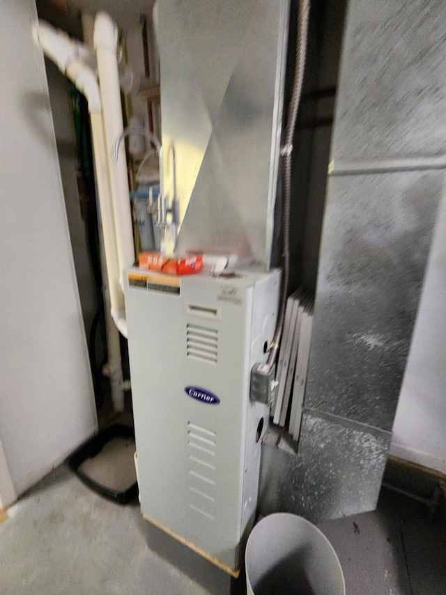 7451 June Ave, Saint Helen, MI 48656 - utility room featuring heating unit