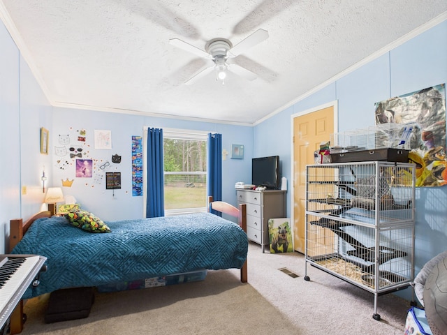 2651 Chipmunk Trl, Grayling, MI 49738 - carpeted bedroom with ornamental molding, a textured ceiling, and a ceiling fan