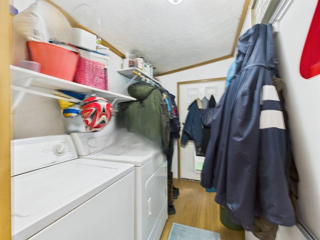 2651 Chipmunk Trl, Grayling, MI 49738 - laundry room featuring independent washer and dryer, wood finished floors, and a textured ceiling