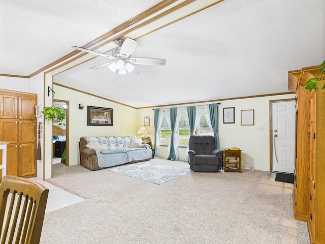 2651 Chipmunk Trl, Grayling, MI 49738 - living room featuring vaulted ceiling, carpet floors, crown molding, and a ceiling fan
