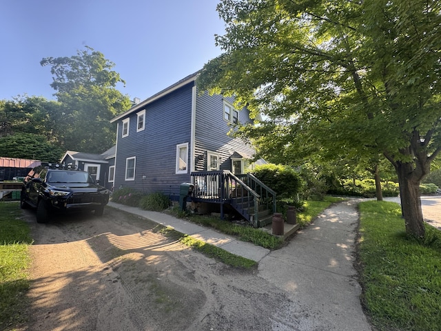 215 W Lake St, Petoskey, MI 49770 - view of side of property featuring driveway