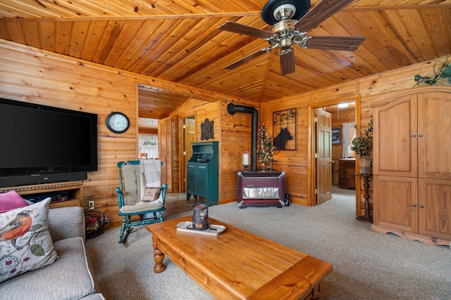 1960 Highbank Trl, Lewiston, MI 49756 - living room with wood walls, a wood stove, carpet, wood ceiling, and a ceiling fan
