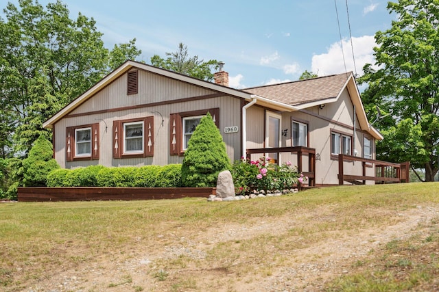 1960 Highbank Trl, Lewiston, MI 49756 - view of front of property with a chimney and a front yard