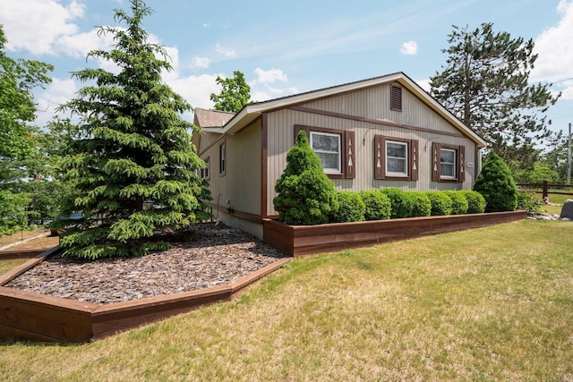 1960 Highbank Trl, Lewiston, MI 49756 - view of side of property with a lawn