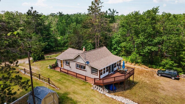 1960 Highbank Trl, Lewiston, MI 49756 - aerial view of property and surrounding area with a heavily wooded area
