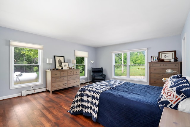 9660 Richardson Rd, Cheboygan, MI 49721 - bedroom featuring baseboard heating and hardwood / wood-style flooring