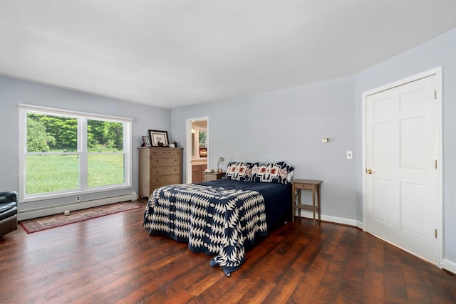 9660 Richardson Rd, Cheboygan, MI 49721 - bedroom featuring a baseboard heating unit and wood finished floors