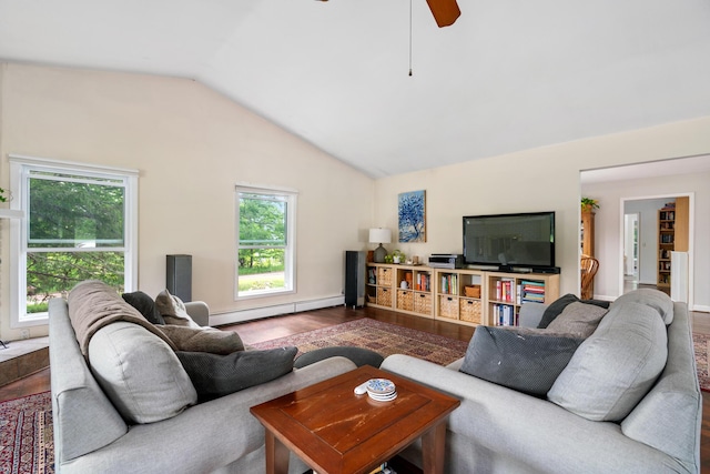9660 Richardson Rd, Cheboygan, MI 49721 - living area featuring a baseboard heating unit, vaulted ceiling, ceiling fan, and wood finished floors