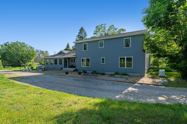9660 Richardson Rd, Cheboygan, MI 49721 - back of property featuring a lawn