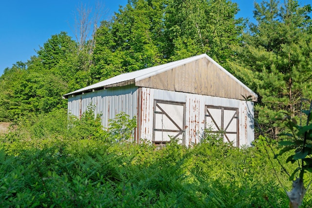 9660 Richardson Rd, Cheboygan, MI 49721 - view of outbuilding featuring a wooded view