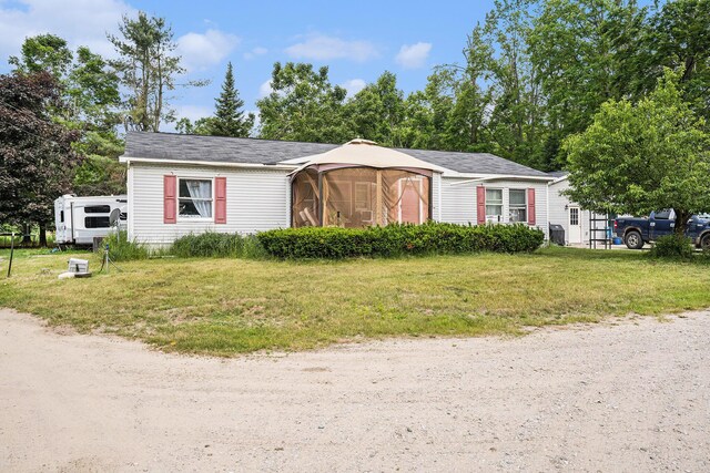 6304 Old 27, Vanderbilt, MI 49795 - view of front of house with a front lawn