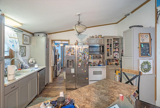 6304 Old 27, Vanderbilt, MI 49795 - kitchen featuring appliances with stainless steel finishes, crown molding, a textured ceiling, gray cabinets, and dark wood-style floors