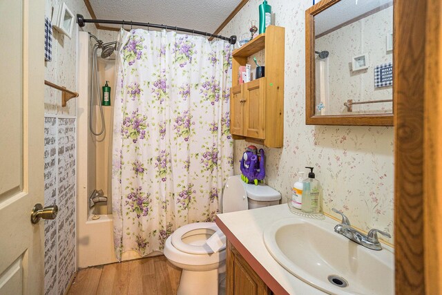 6304 Old 27, Vanderbilt, MI 49795 - bathroom featuring wood finished floors, vanity, a textured ceiling, and shower / tub combo with curtain