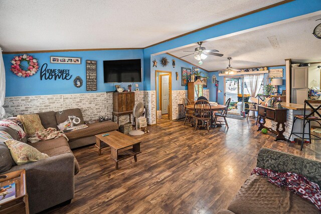 6304 Old 27, Vanderbilt, MI 49795 - living room featuring a wainscoted wall, a textured ceiling, lofted ceiling, crown molding, and ceiling fan