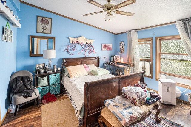 6304 Old 27, Vanderbilt, MI 49795 - bedroom with vaulted ceiling, wood finished floors, ornamental molding, a textured ceiling, and ceiling fan