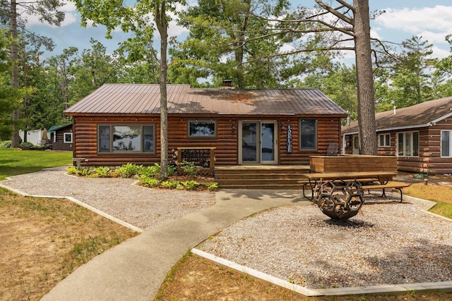 2061 Dreamers Ln, Lewiston, MI 49756 - back of house with a metal roof