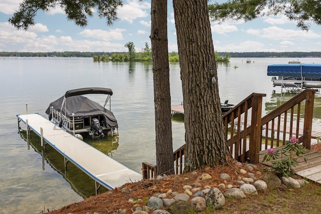 2061 Dreamers Ln, Lewiston, MI 49756 - dock with boat lift and a water view
