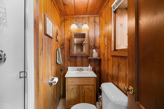 2061 Dreamers Ln, Lewiston, MI 49756 - bathroom with wood walls, wooden ceiling, and vanity