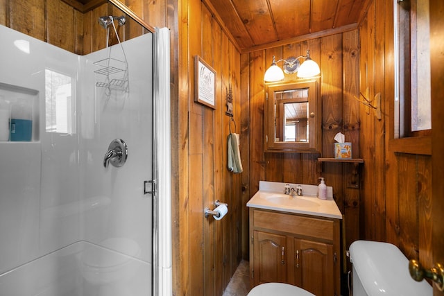 2061 Dreamers Ln, Lewiston, MI 49756 - bathroom featuring a stall shower, wood walls, vanity, and wooden ceiling