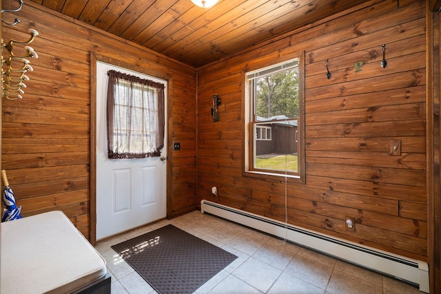 2061 Dreamers Ln, Lewiston, MI 49756 - doorway with a baseboard radiator, wooden ceiling, wooden walls, and light tile patterned flooring