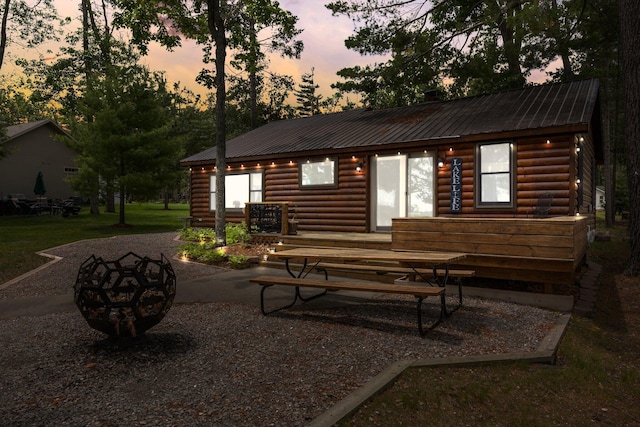 2061 Dreamers Ln, Lewiston, MI 49756 - rear view of property with a metal roof and log veneer siding