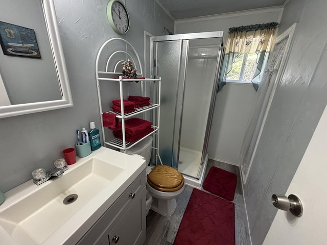 10604 Adams St, Ossineke, MI 49766 - full bathroom featuring a shower stall, vanity, wood finished floors, and a textured ceiling