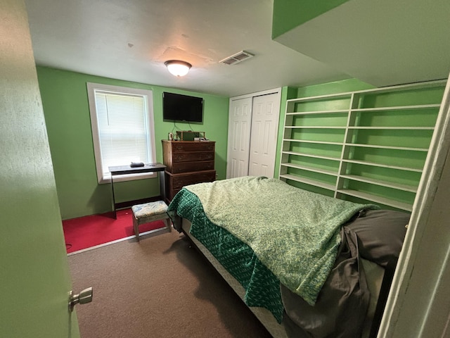 10604 Adams St, Ossineke, MI 49766 - bedroom with dark colored carpet and a closet
