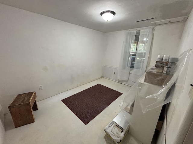 10604 Adams St, Ossineke, MI 49766 - empty room with concrete floors