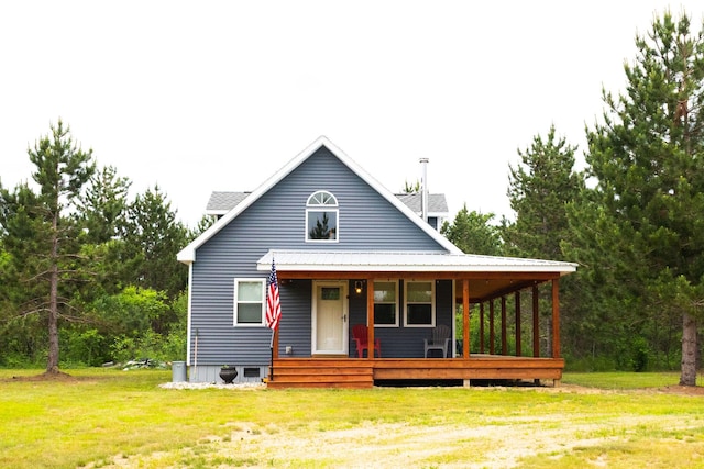 4696 Glacial Field Dr, Elmira, MI 49730 - view of front of house featuring covered porch and a front yard
