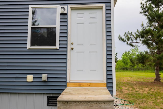 4696 Glacial Field Dr, Elmira, MI 49730 - doorway to property with a yard
