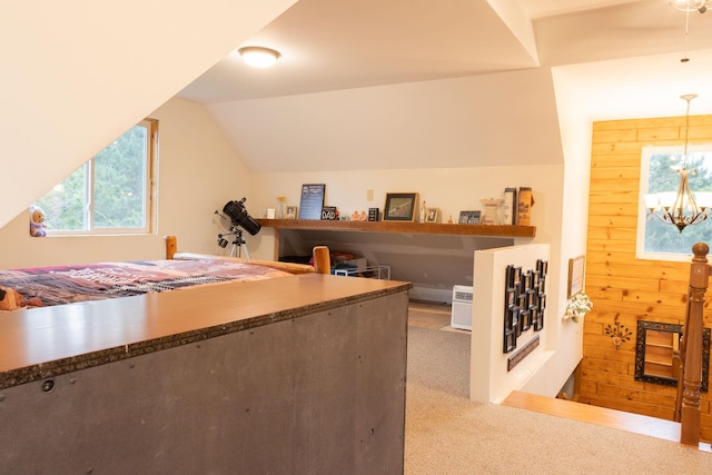 4696 Glacial Field Dr, Elmira, MI 49730 - bedroom with carpet floors, a chandelier, and lofted ceiling