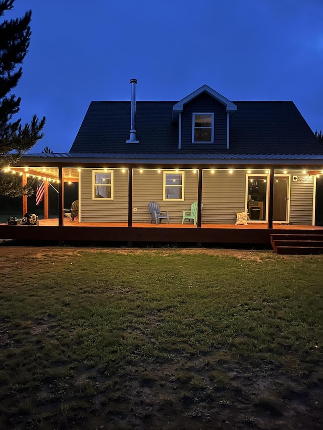 4696 Glacial Field Dr, Elmira, MI 49730 - rear view of property with a yard and a deck