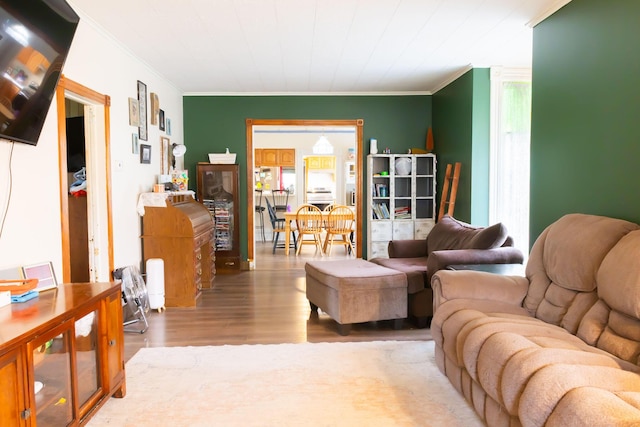 210 N Maple St, Mancelona, MI 49659 - living area with crown molding and wood finished floors