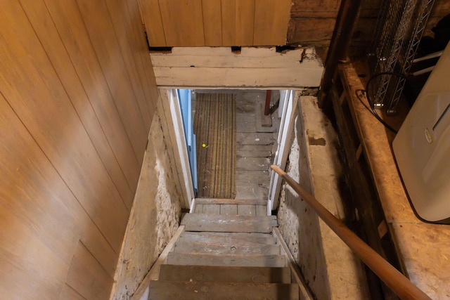 210 N Maple St, Mancelona, MI 49659 - stairway with wood walls