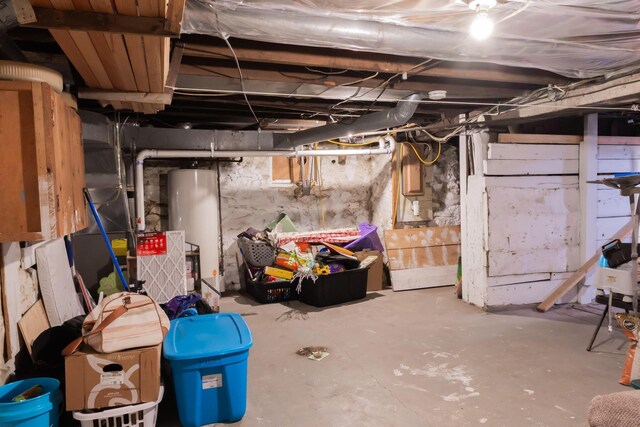 210 N Maple St, Mancelona, MI 49659 - unfinished below grade area with water heater