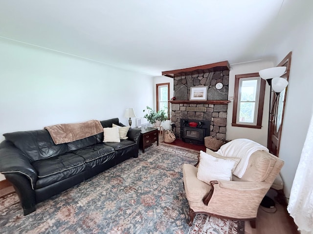 3628 Rau Rd, West Branch, MI 48661 - living area featuring a wood stove and wood finished floors